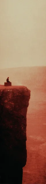 Free aesthetic bookmark featuring someone sitting on a cliff